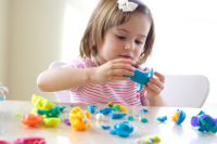 iStock_000011749810XSmall - girl playing with playdoh - fine motor, sensory.jpg